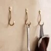Curvature Wall Hook (Set Of 3) By Ferm Living -Lulu Andgeorgia Shop fermLIVING CurvatureHooksSetOf3 Brass image